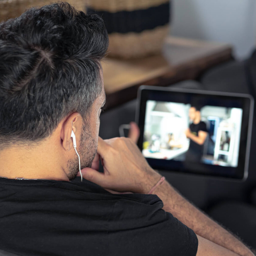 man hand using digital tablet watching online cook 2023 11 27 05 03 43 utc.jpg